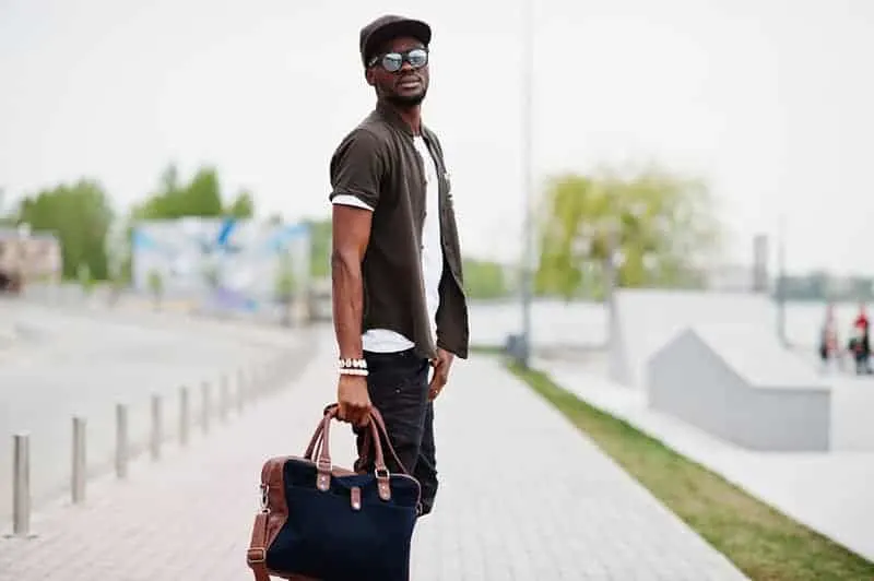 man holding a bag outside