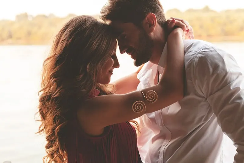 pretty couple standing in hug