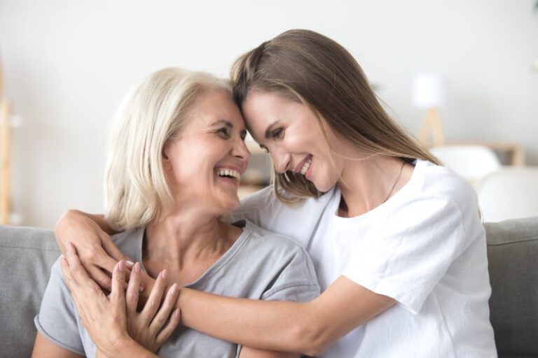 girl hugging mother