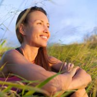 happy woman in grass