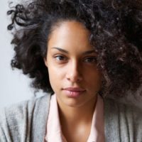 Close up portrait of an attractive young african american woman looking at camera