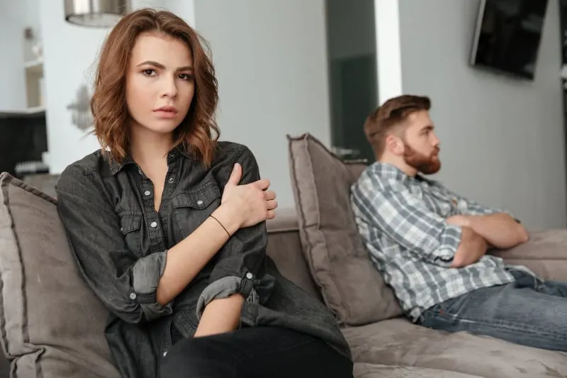 sad couple sitting