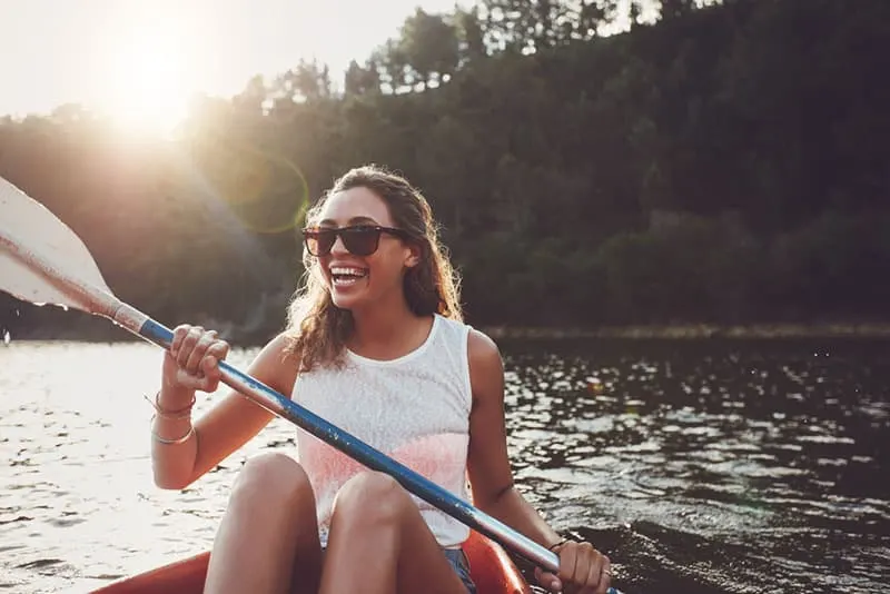 smiling woman kayaking