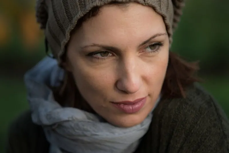 woman with green eyes looking away