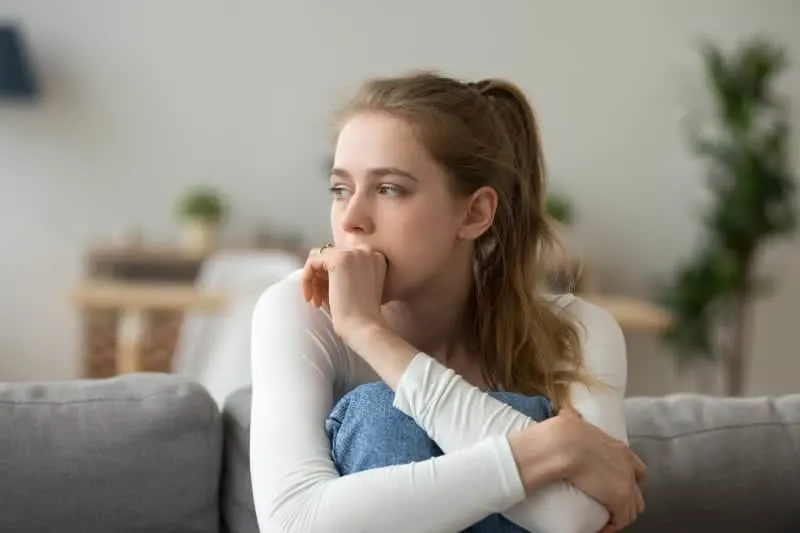 worried woman about to cry at home