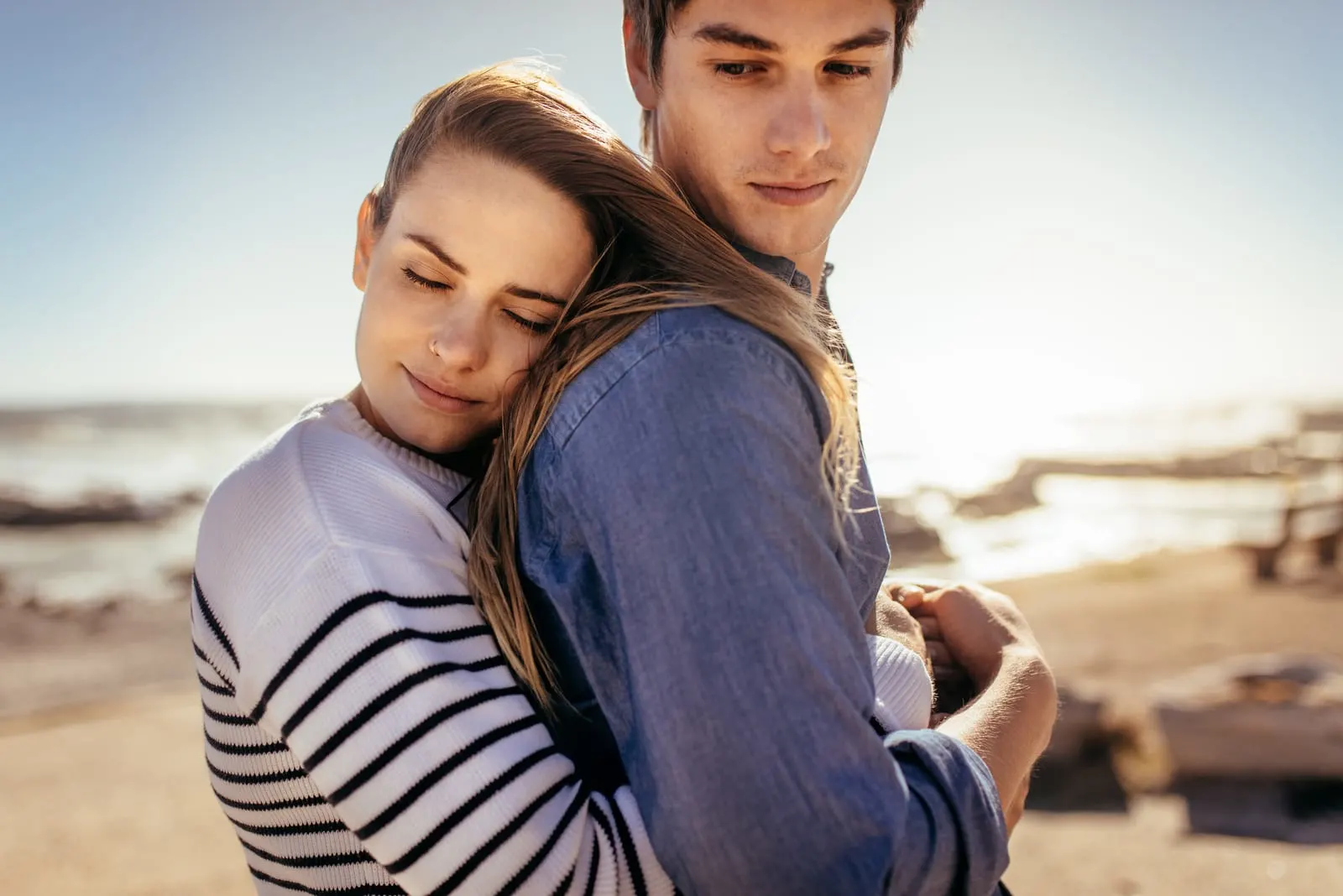 young woman hugging man 