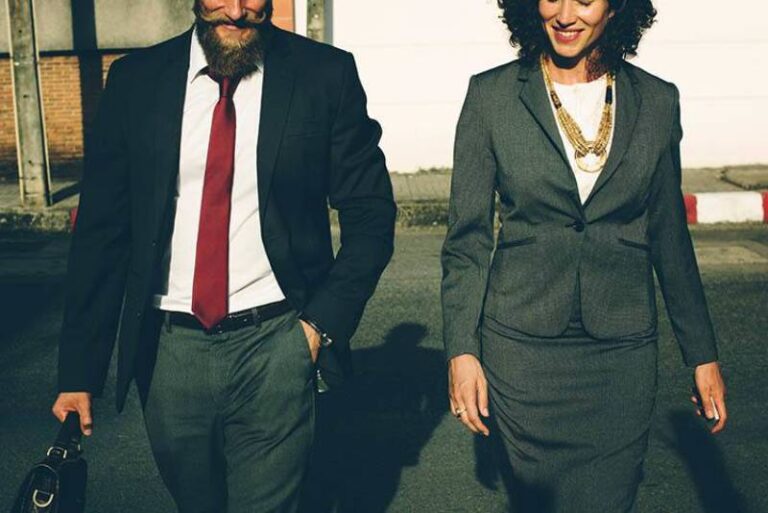 business man and woman walking outside