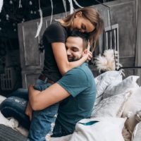 couple hugging on bed