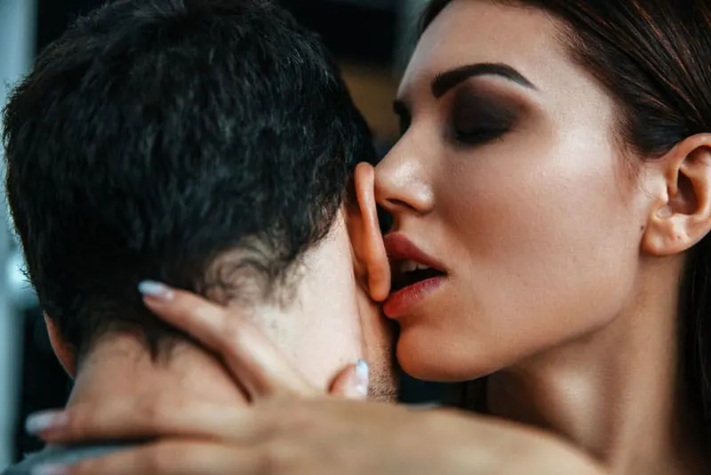 Sensual young couple Portrait. Flirting and kissing