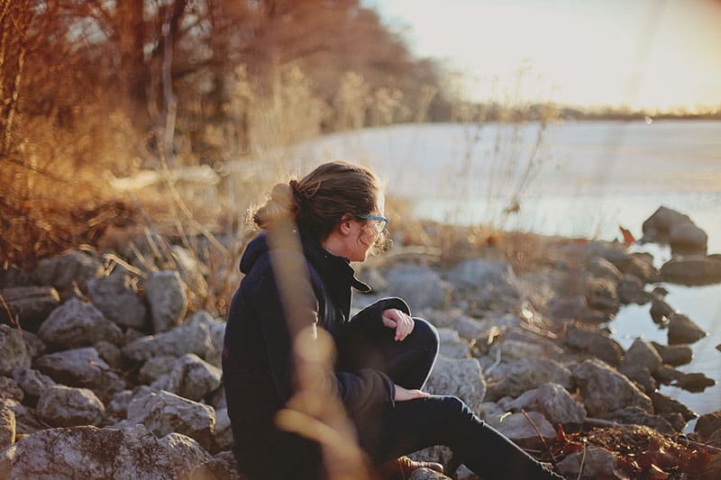 sad woman by the lake