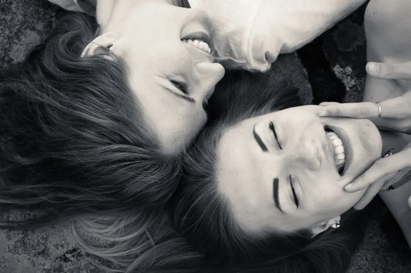 black and white photo of laughing female friends