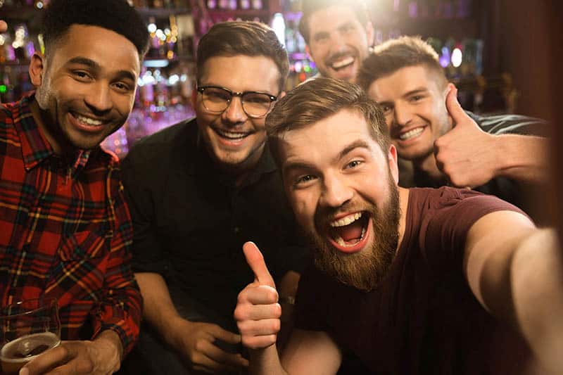 group of male friends taking a selfie