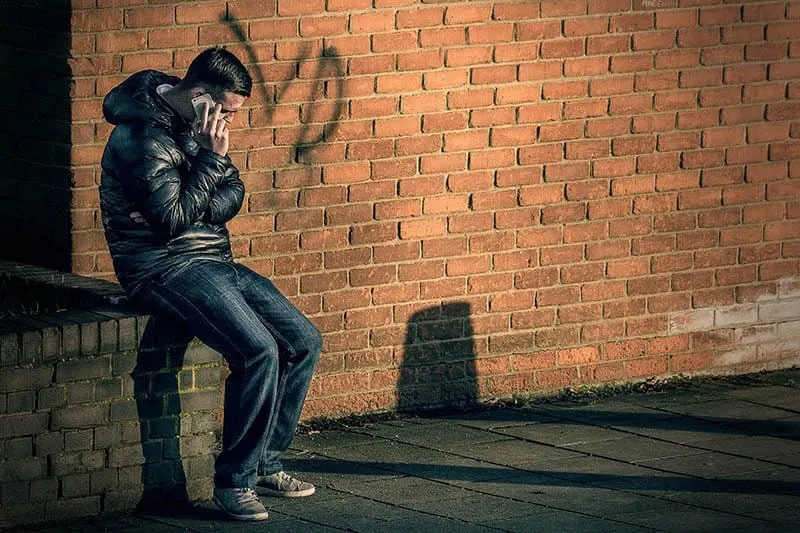 man talking on the phone outside