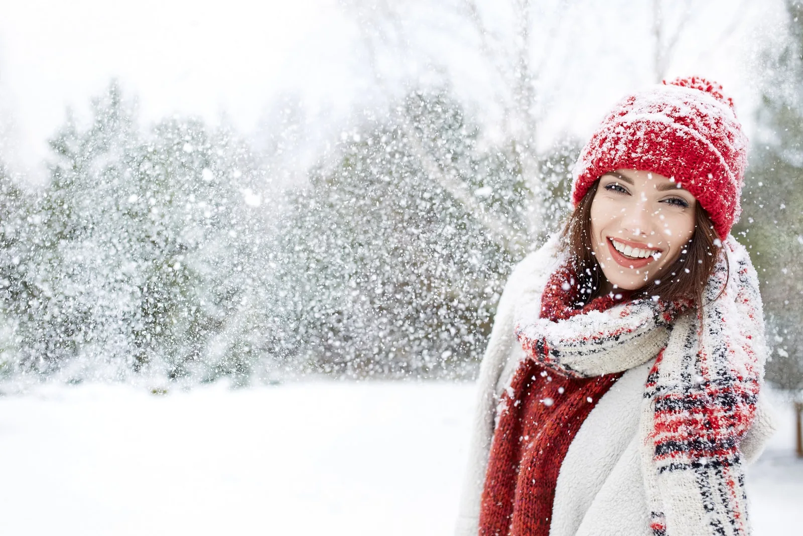 portrait of a smiling girl in the snow outside