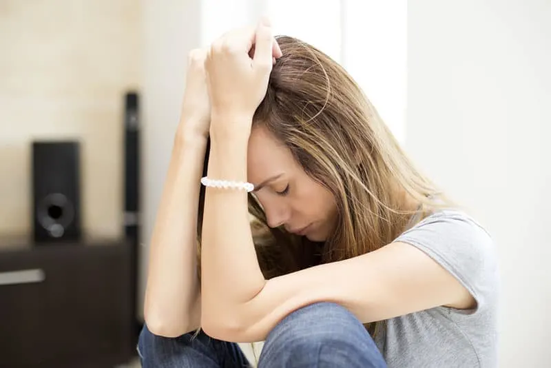 sad woman sitting alone