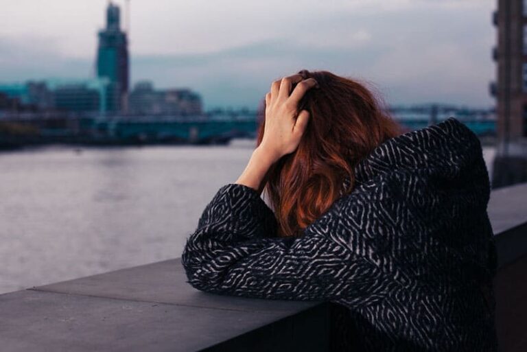 sad woman by the river