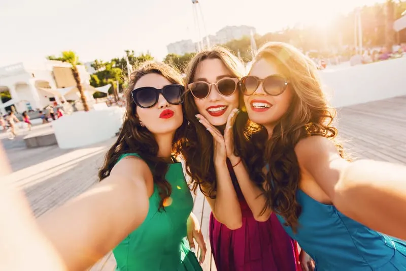 three female friends taking selfie