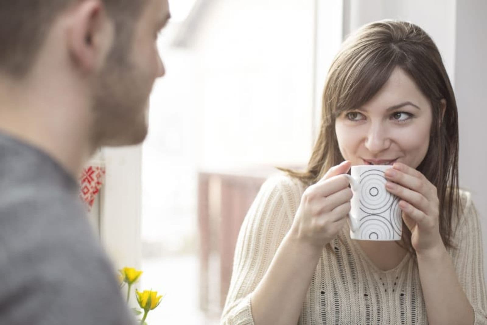 woman drinking tea and listening to hey boyfriend