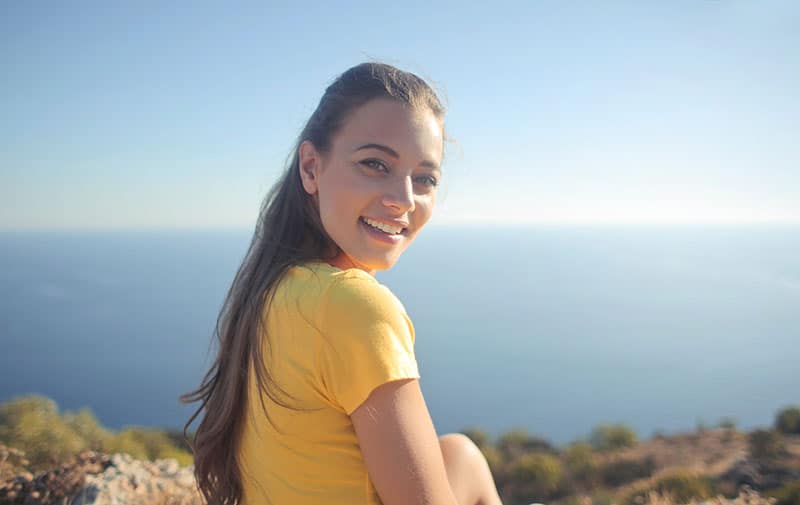 woman in a yellow shirt