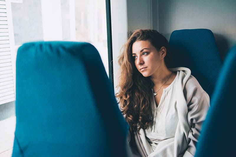 young brunette woman in public transport