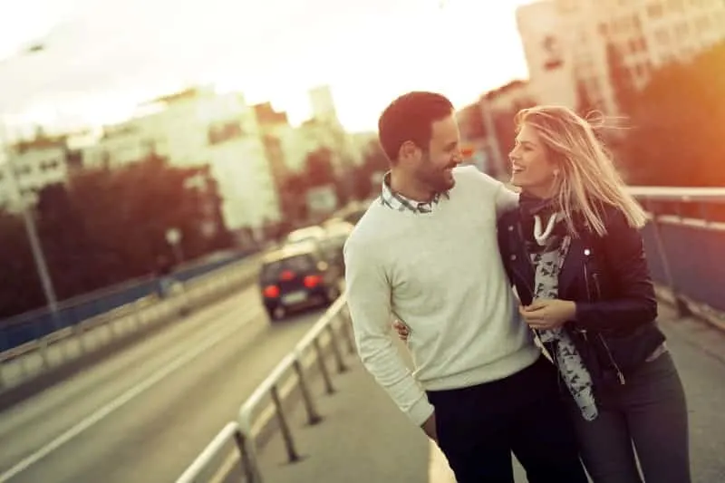 Couple in sunset while walking