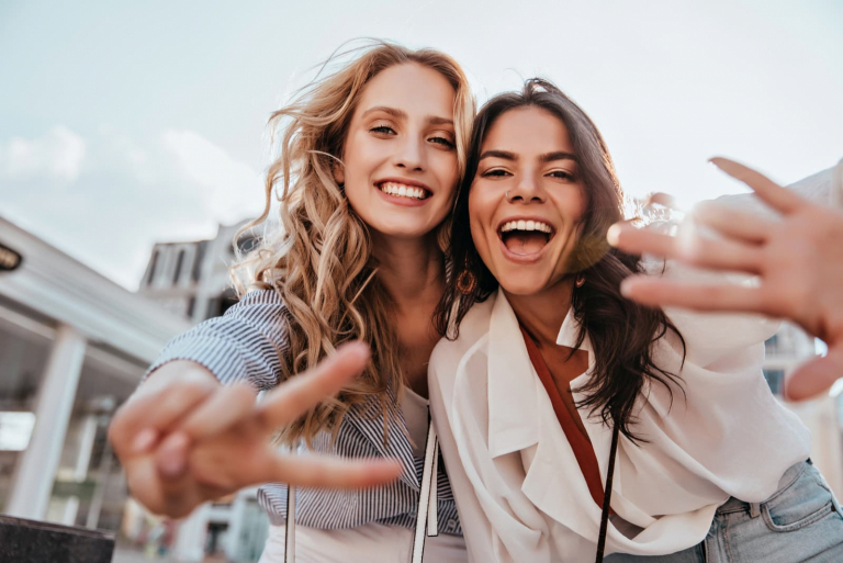 friends embracing laughing