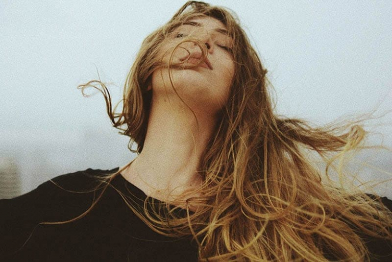 woman's hair waves in the wind