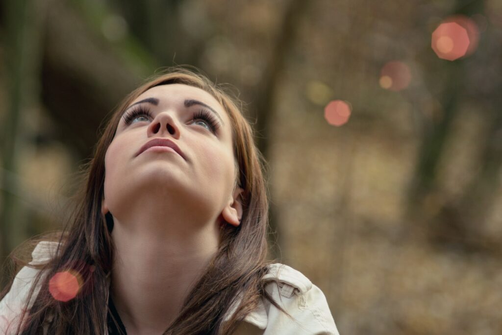 a beautiful young girl in the woods