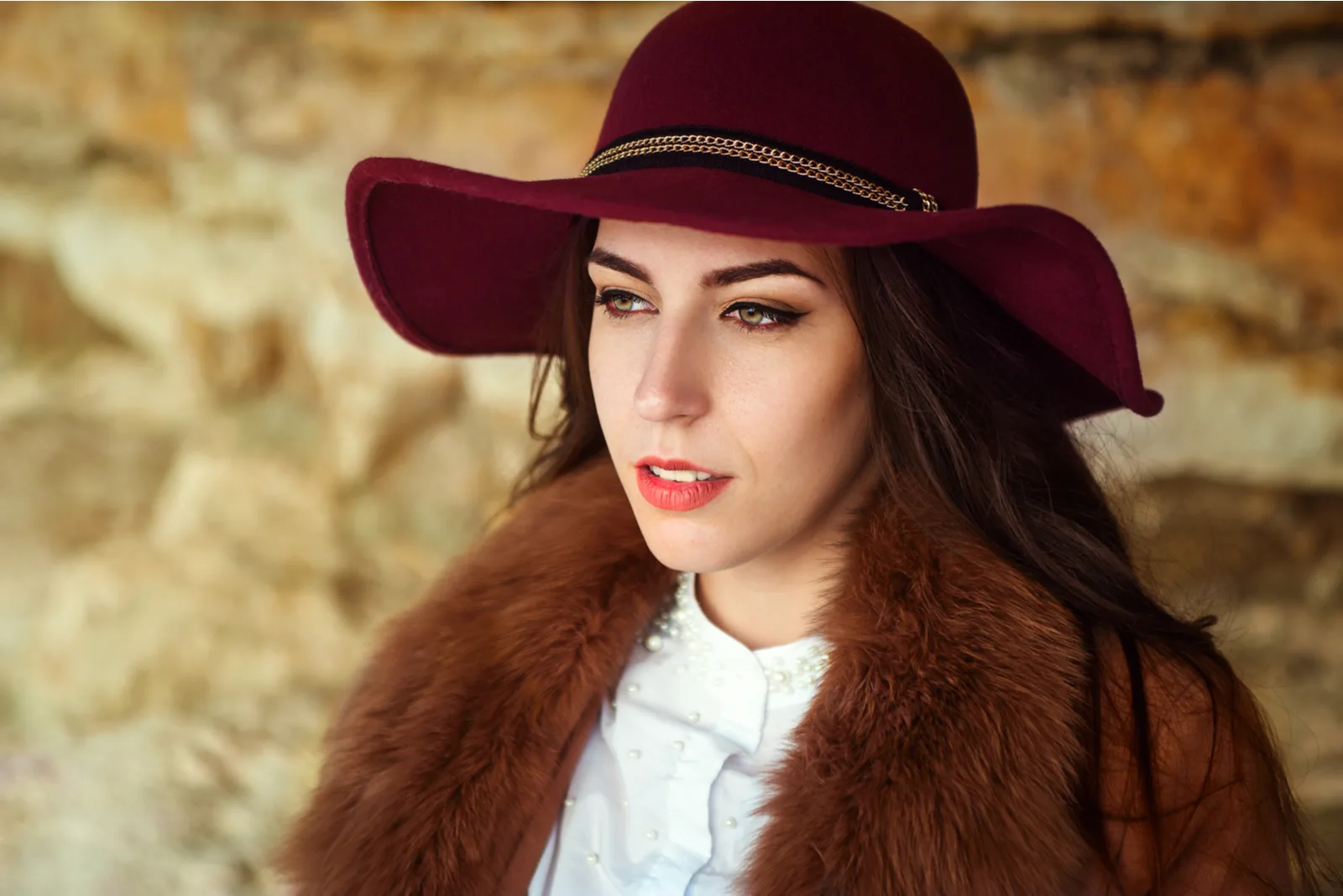beautiful serious brunette with a hat