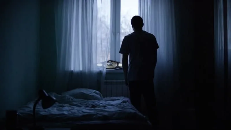 man in alone in the dark