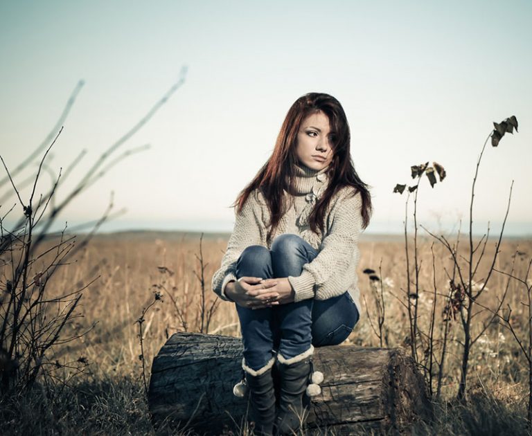 sad girl at fall season meadow