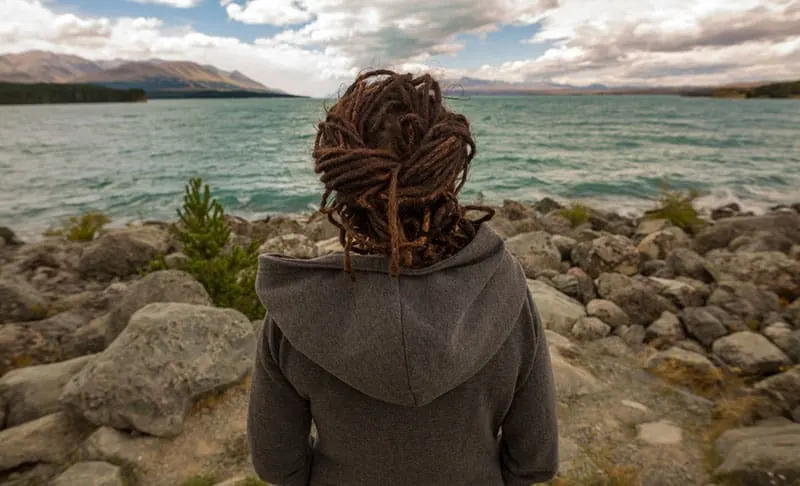 Rear view of a woman looking at lake, New Zealand