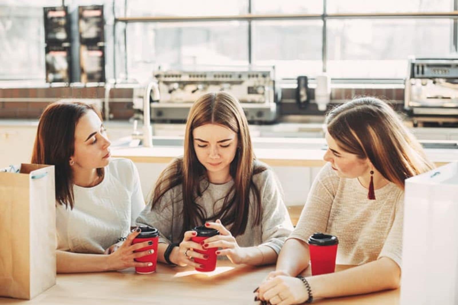 three friends sit and talk