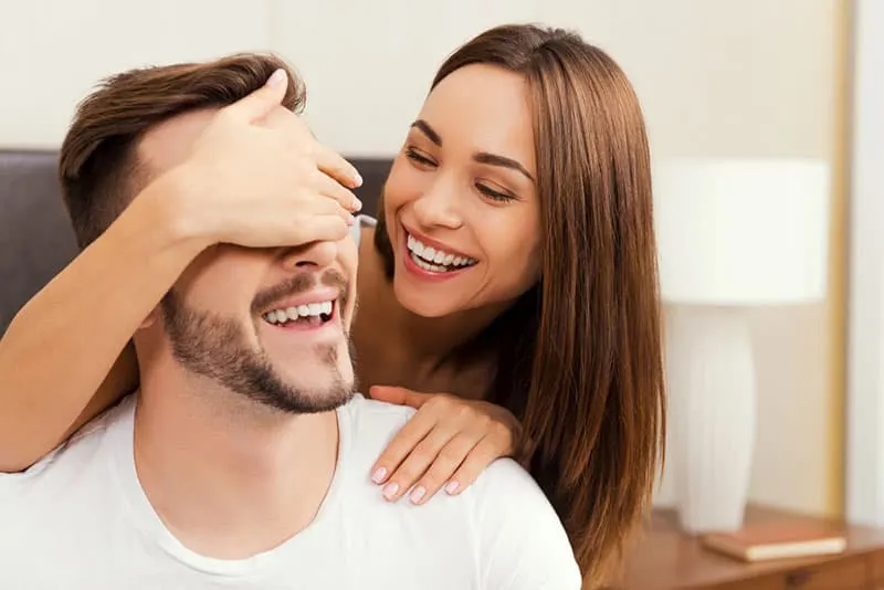 woman surprising man