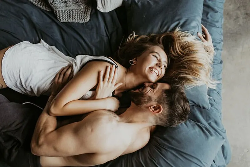 young couple enjoying in bed