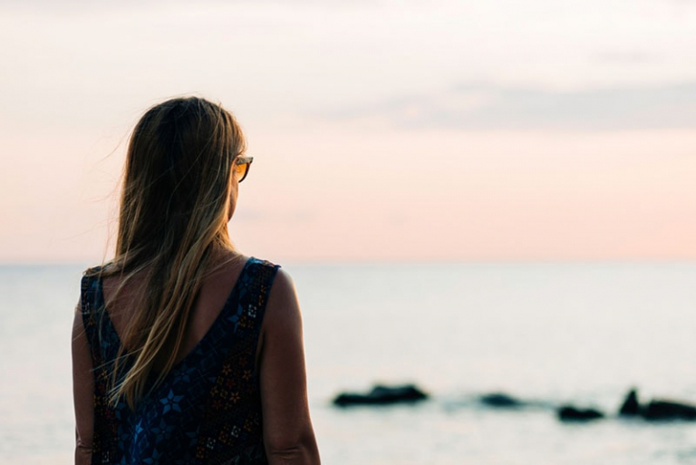 woman standing in front of sea