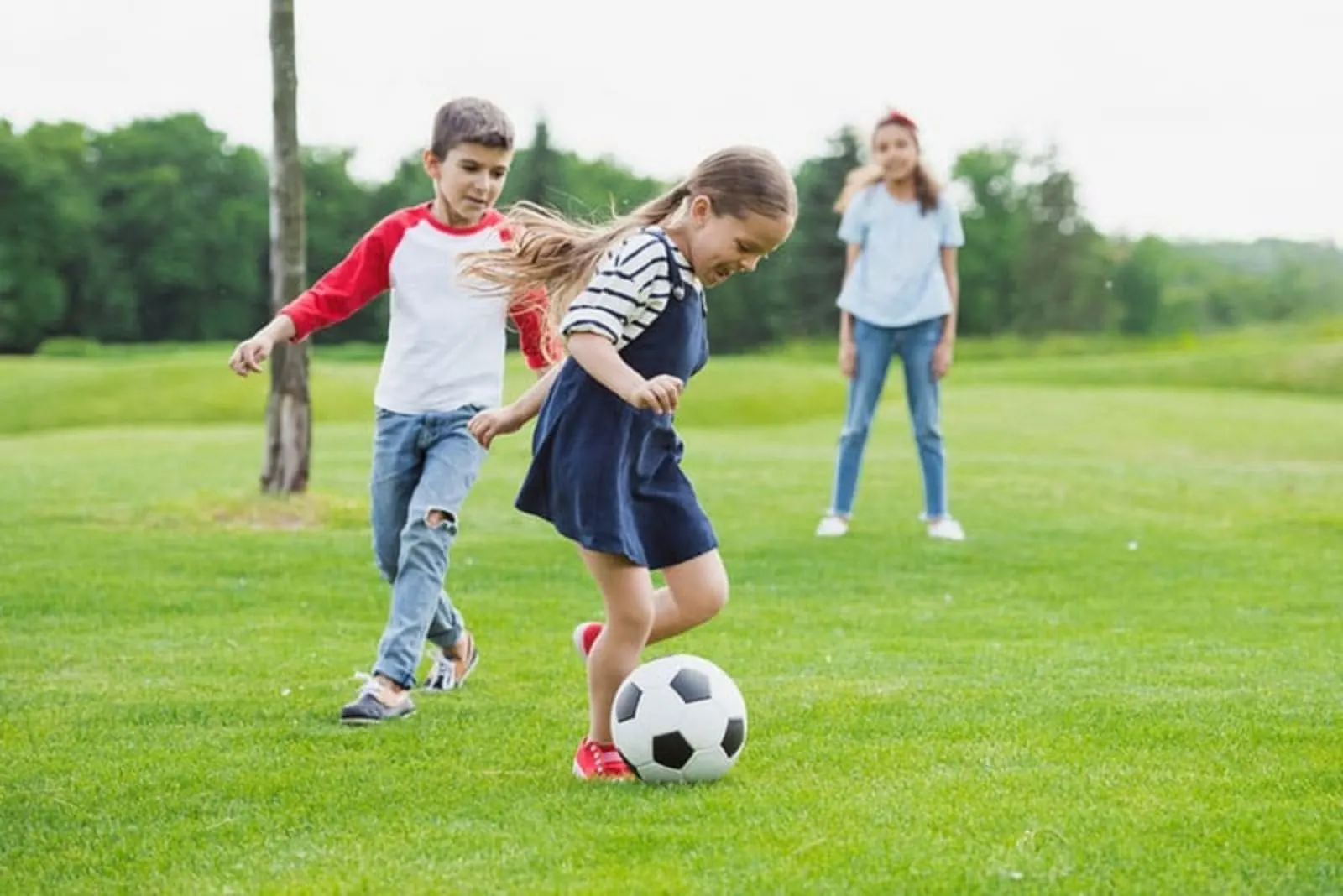 children play football