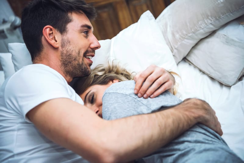 couple in bed hugged