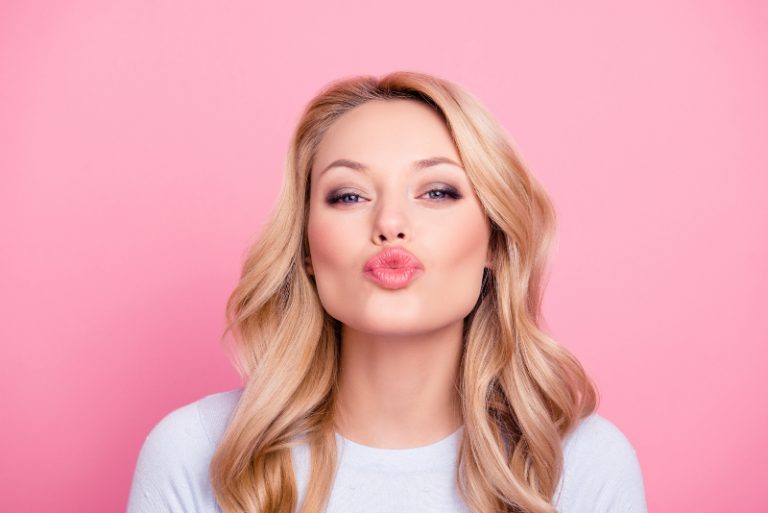 blonde girl sending kiss