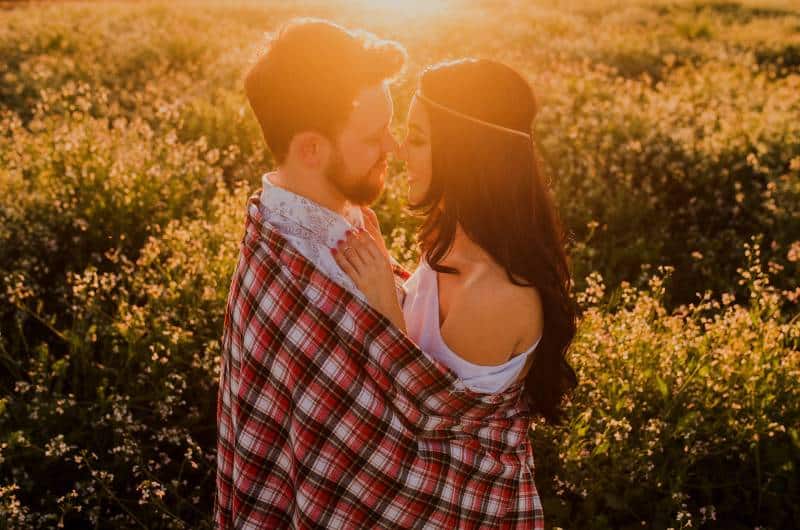 romantic couple hugging on sunset