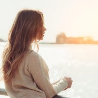 beautiful young girl thinking at bridge