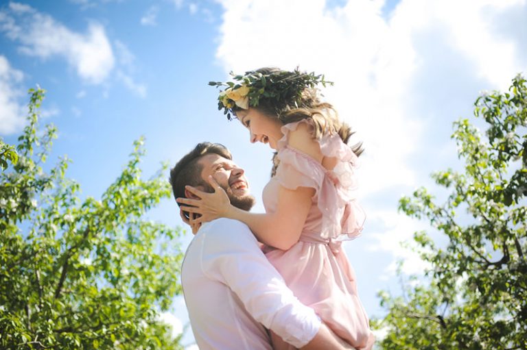 happy man holding his girlfriend