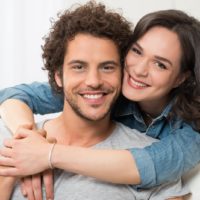 portrait of young smiling man and woman