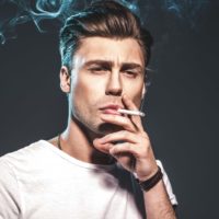 man smoking a cigarette