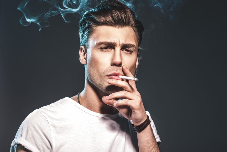 man smoking a cigarette