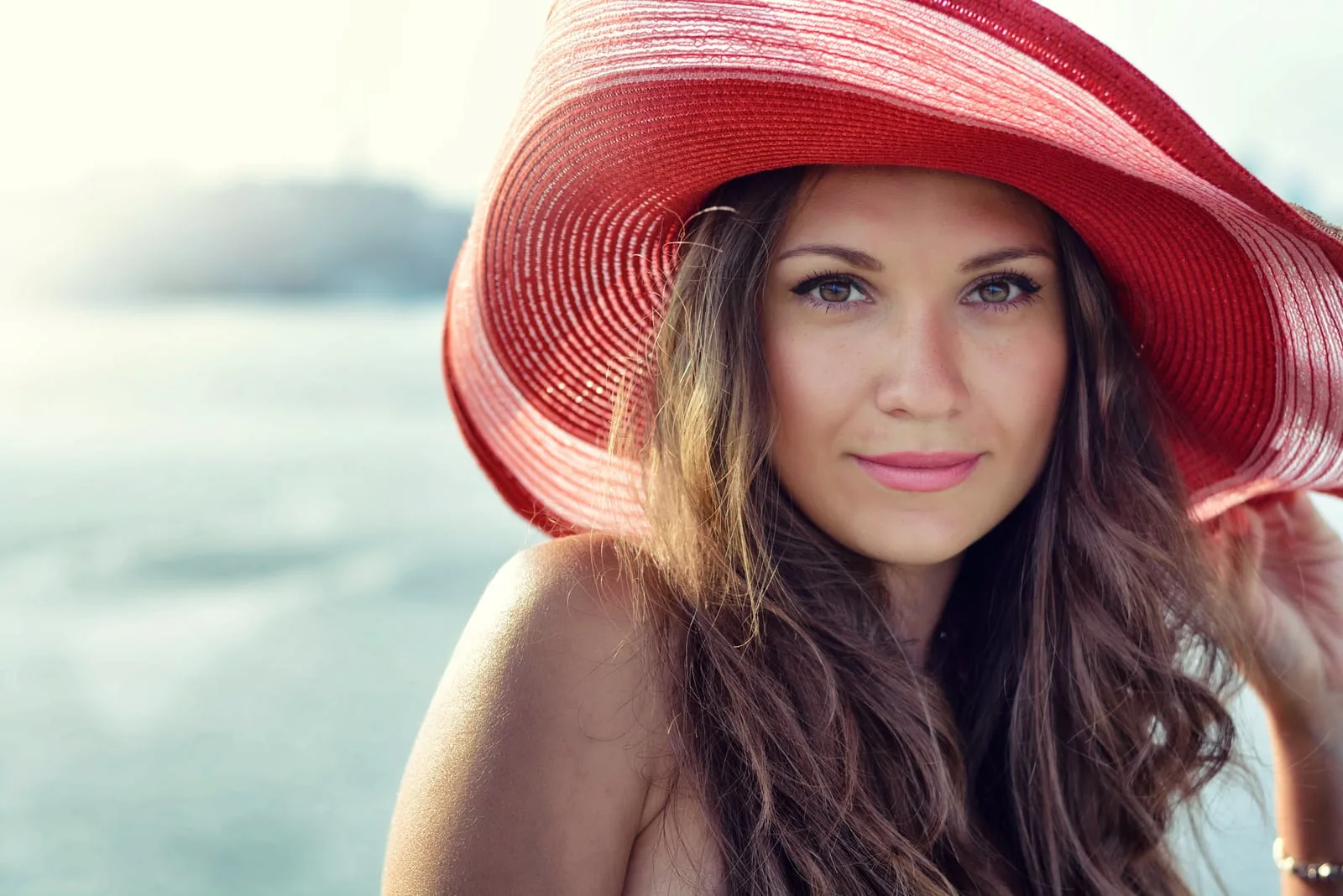 Beautiful girl in a red hat smiling