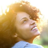 portrait of smiling girl at sunset