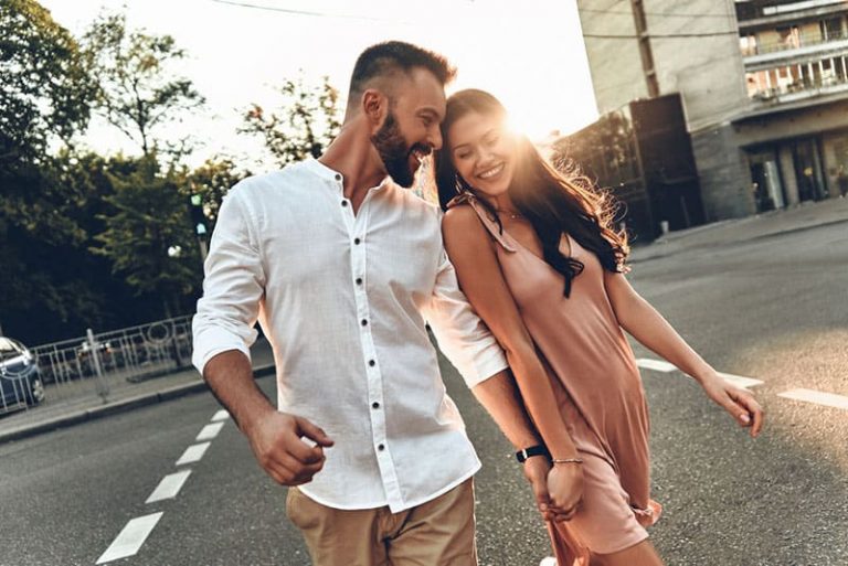 happy man flirting with woman on the street
