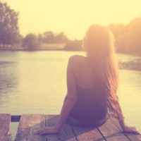 relaxing woman on lake