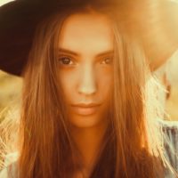 beautiful young woman with hat posing